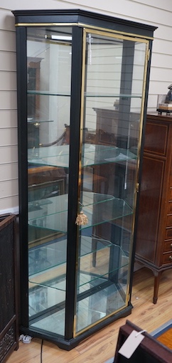 A brass mounted black painted display cabinet with interior lighting, width 92cm, depth 34cm, height 195cm